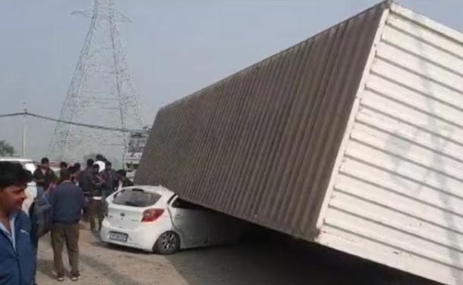 Family escapes unhurt after container falls on their car on Rewari-Delhi National Highway