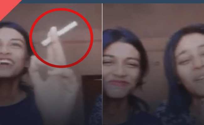 Two girls booked for incoherently singing National Anthem while smoking