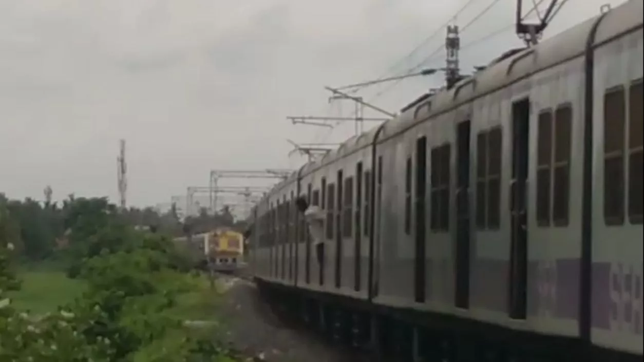 Two local trains stand consecutively at Howrah's station amid ongoing railway disruptions