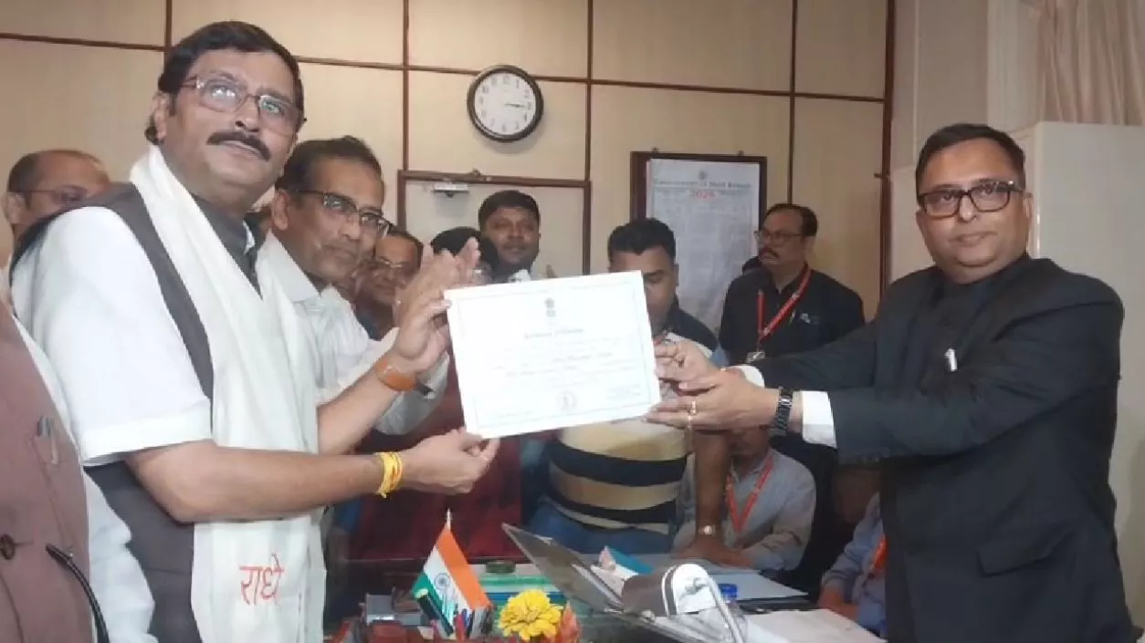 Rahul Sinha greets Babul Supriyo as they enter Rajya Sabha