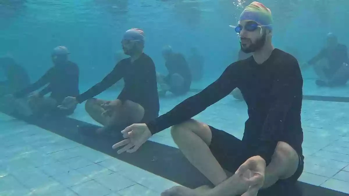 40 Indian Navy submariners perform Yoga under water